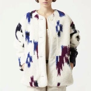 Worn once. Fits oversized . Reversible